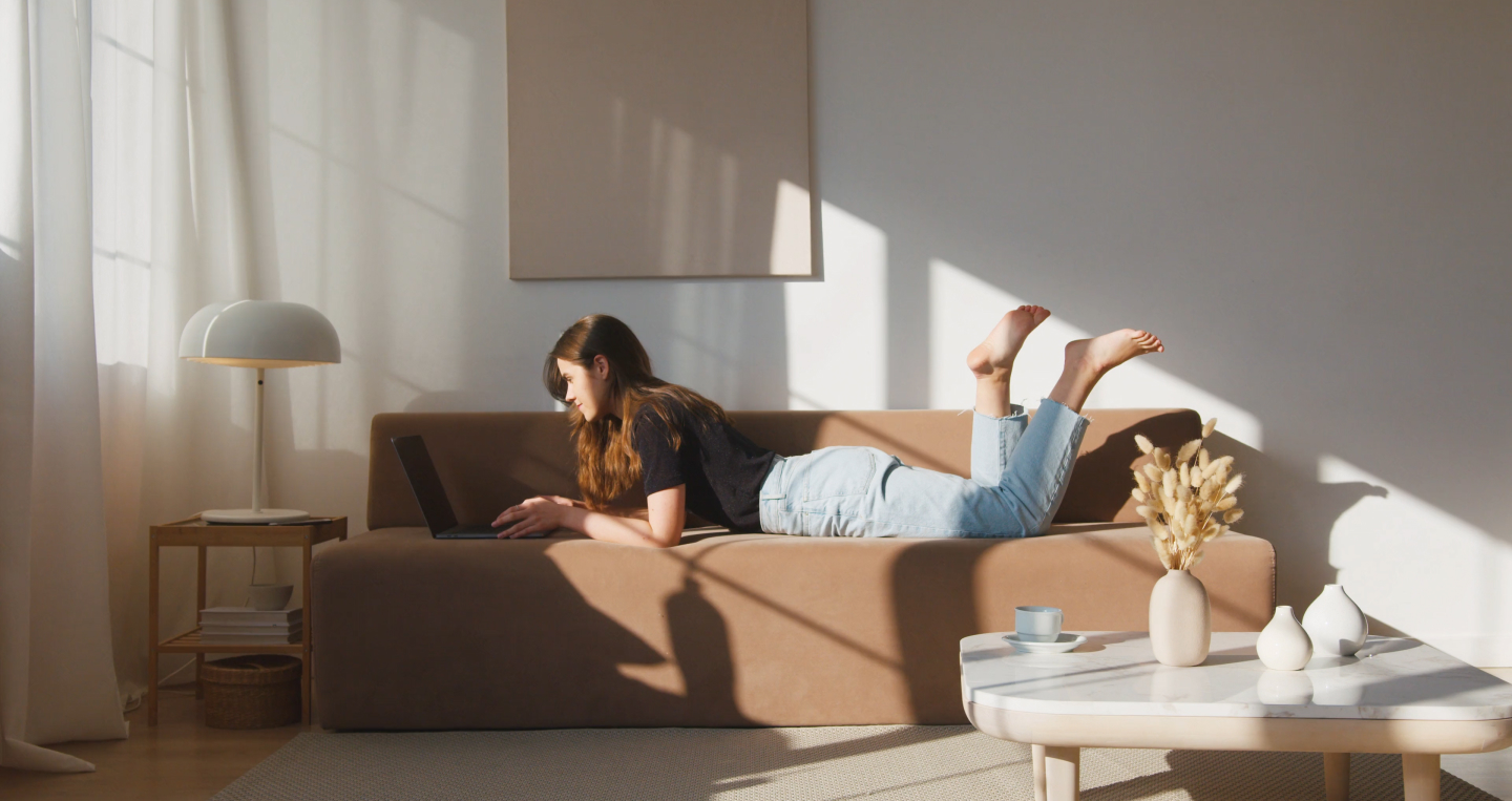 Woman shopping on her computer with stylish decor